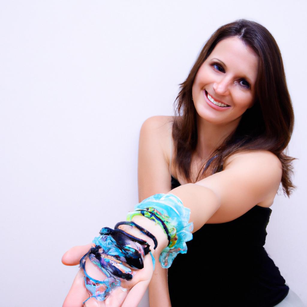 Woman wearing various bracelets, smiling