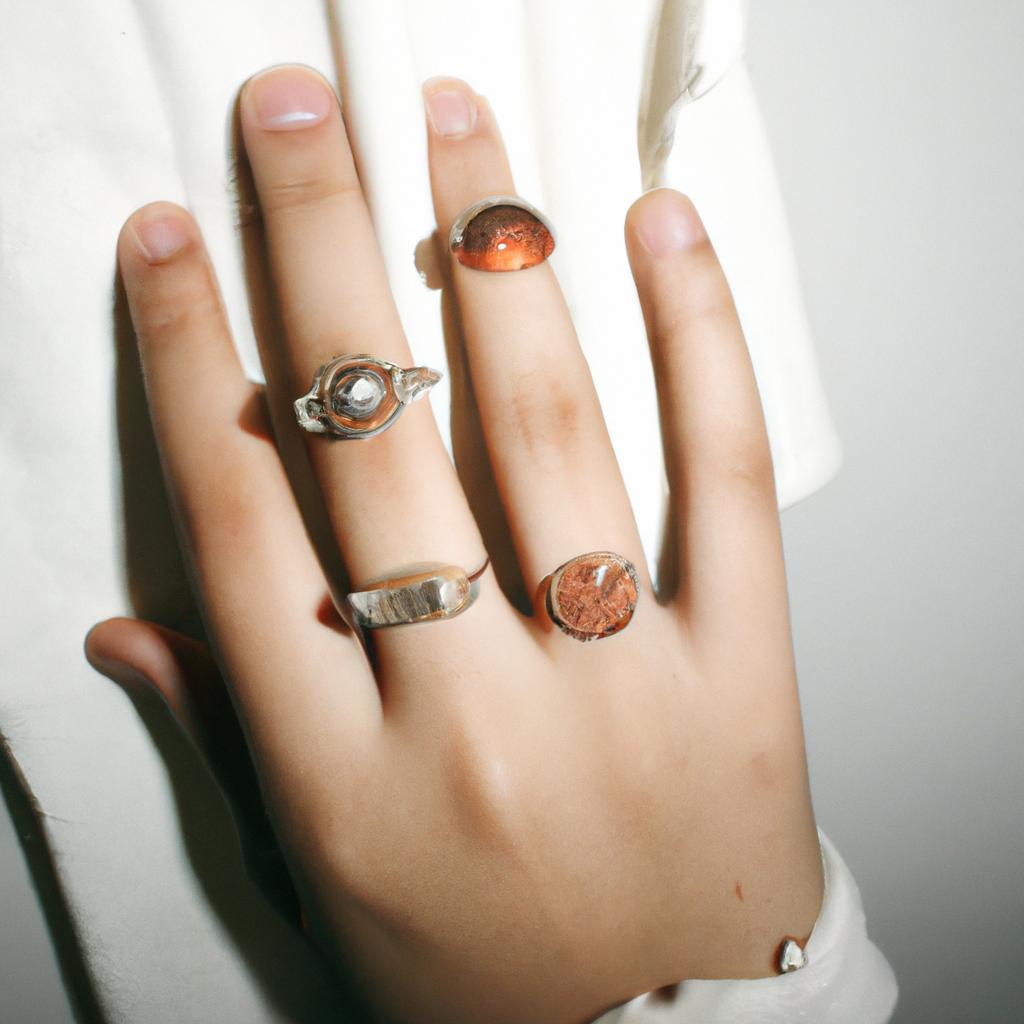 Woman wearing multiple delicate rings