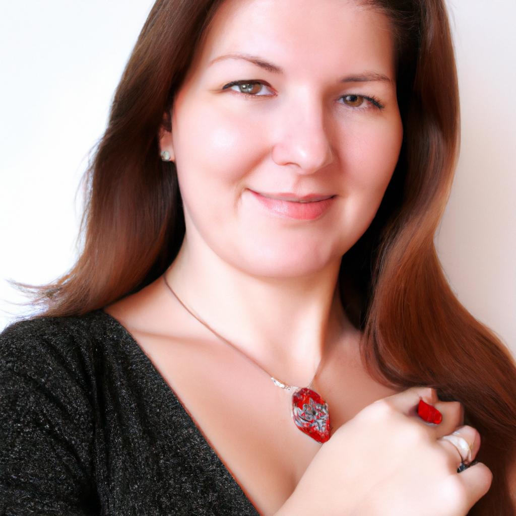 Woman wearing garnet jewelry, smiling