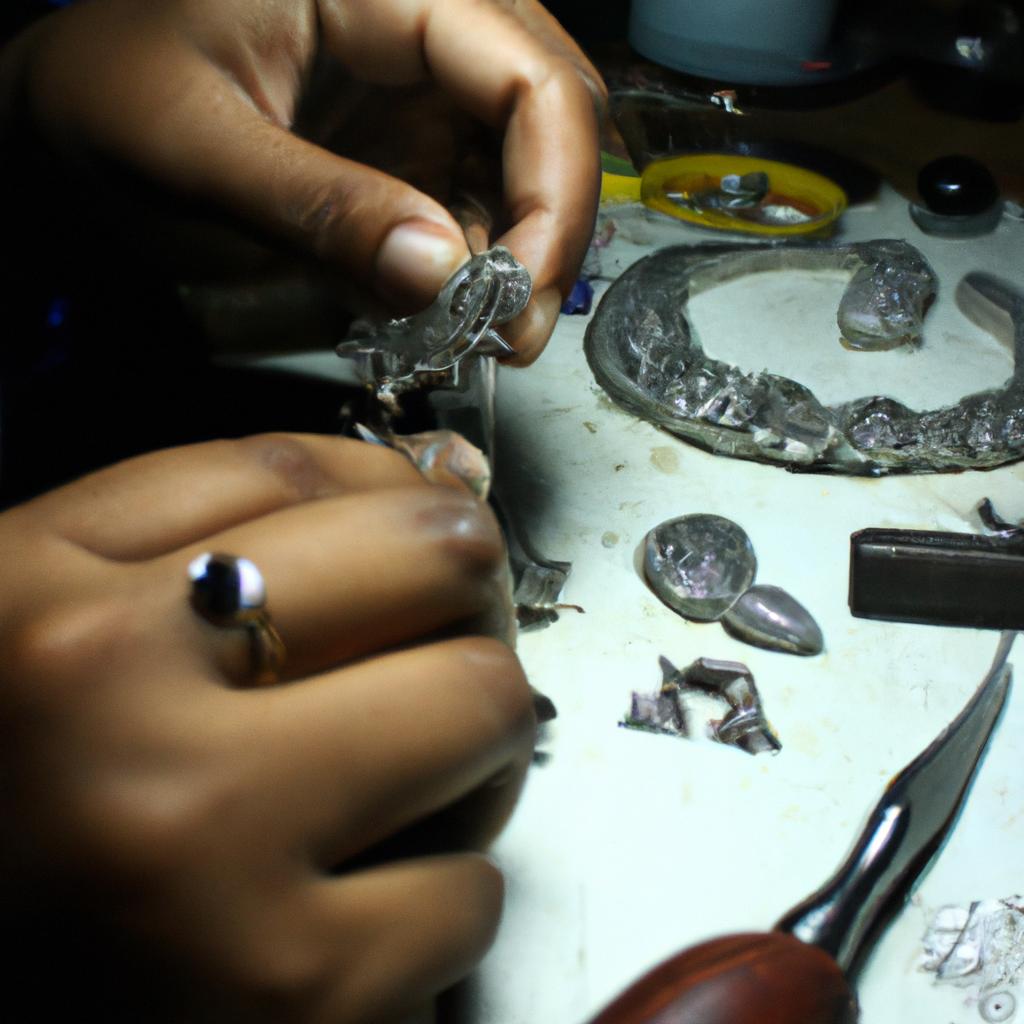 Person crafting intricate jewelry designs