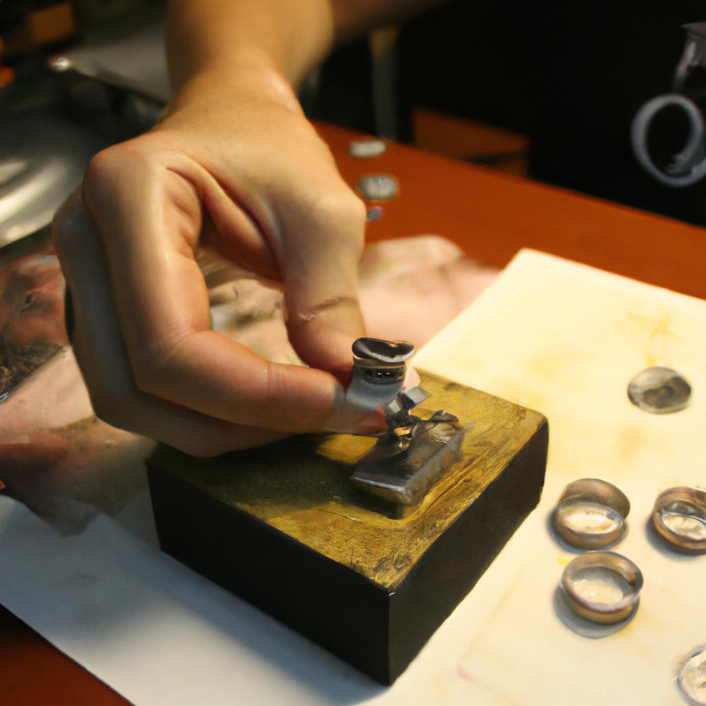Person stamping metal for jewelry